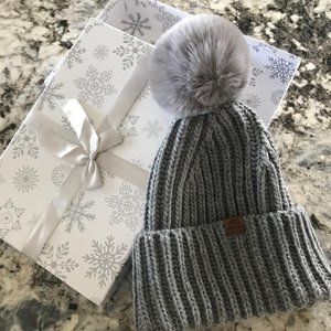 Genuine fur-pommed toque from Roots with gift box.